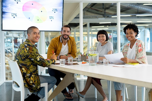 Diverse team collaborating on business strategy in bright modern workspace